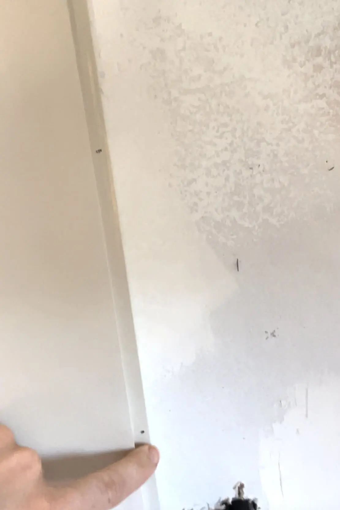 Installing a shiplap backsplash.